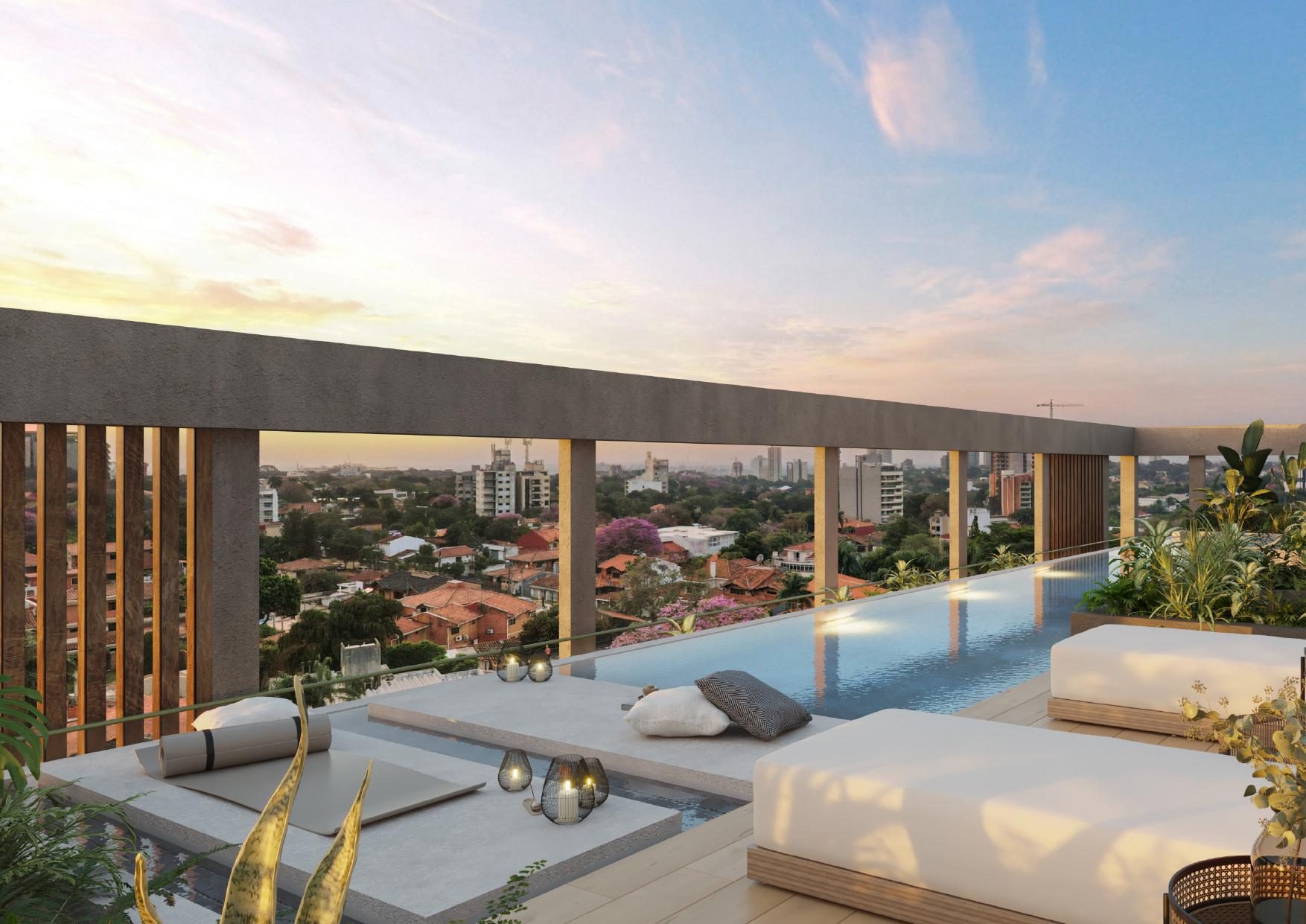 Piscina panorámica en rooftop al atardecer sobre Asunción