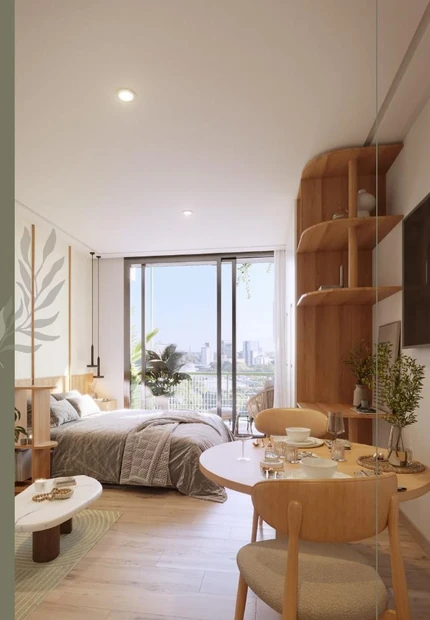 Dormitorio de un apartamento en Asunción con ventanal a la ciudad